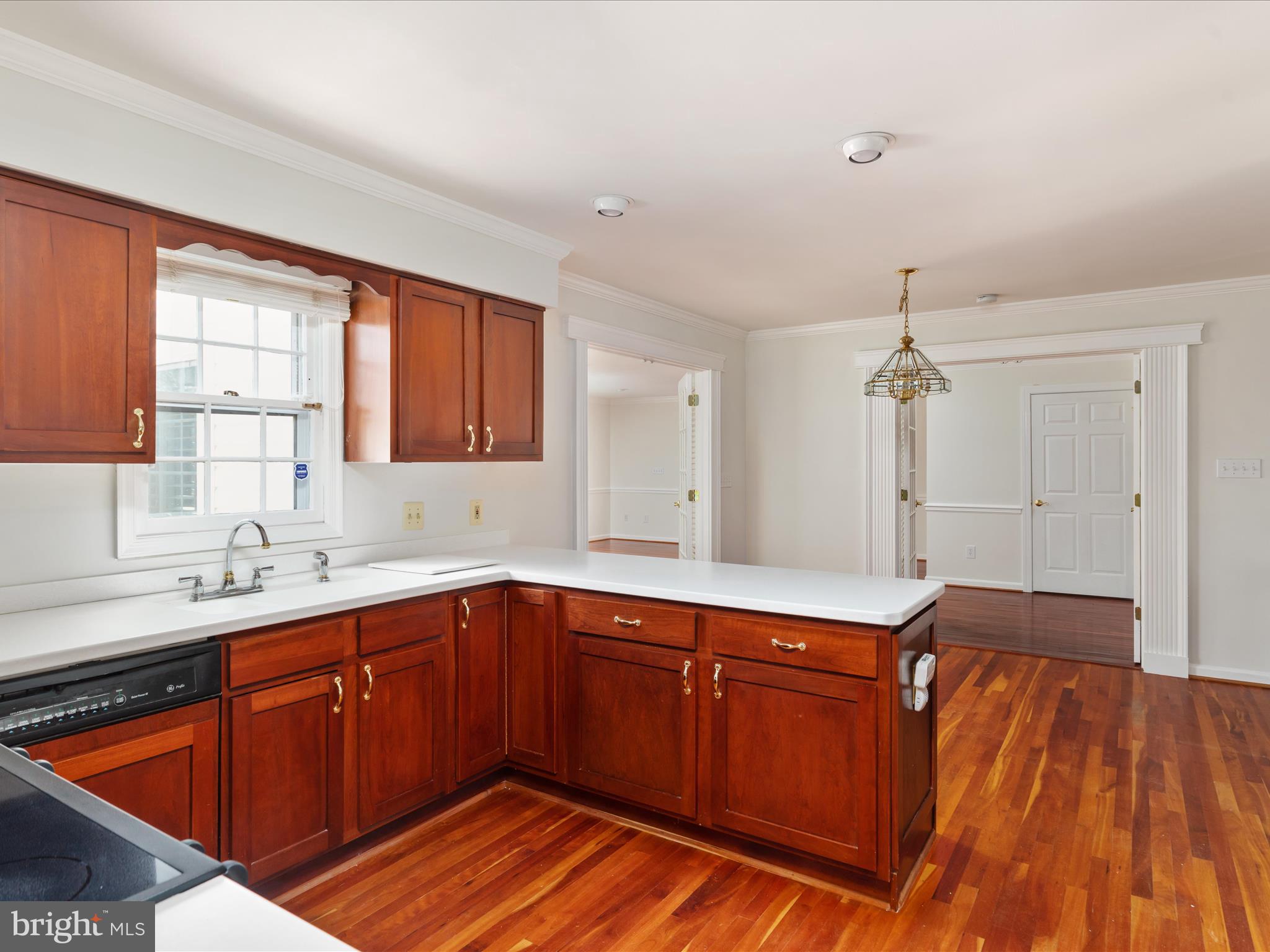 11922 Blue Spruce Road Reston, VA 20191 - Photo 6 of 65 a kitchen with stainless steel appliances granite countertop a sink dishwasher cabinets and wooden floor