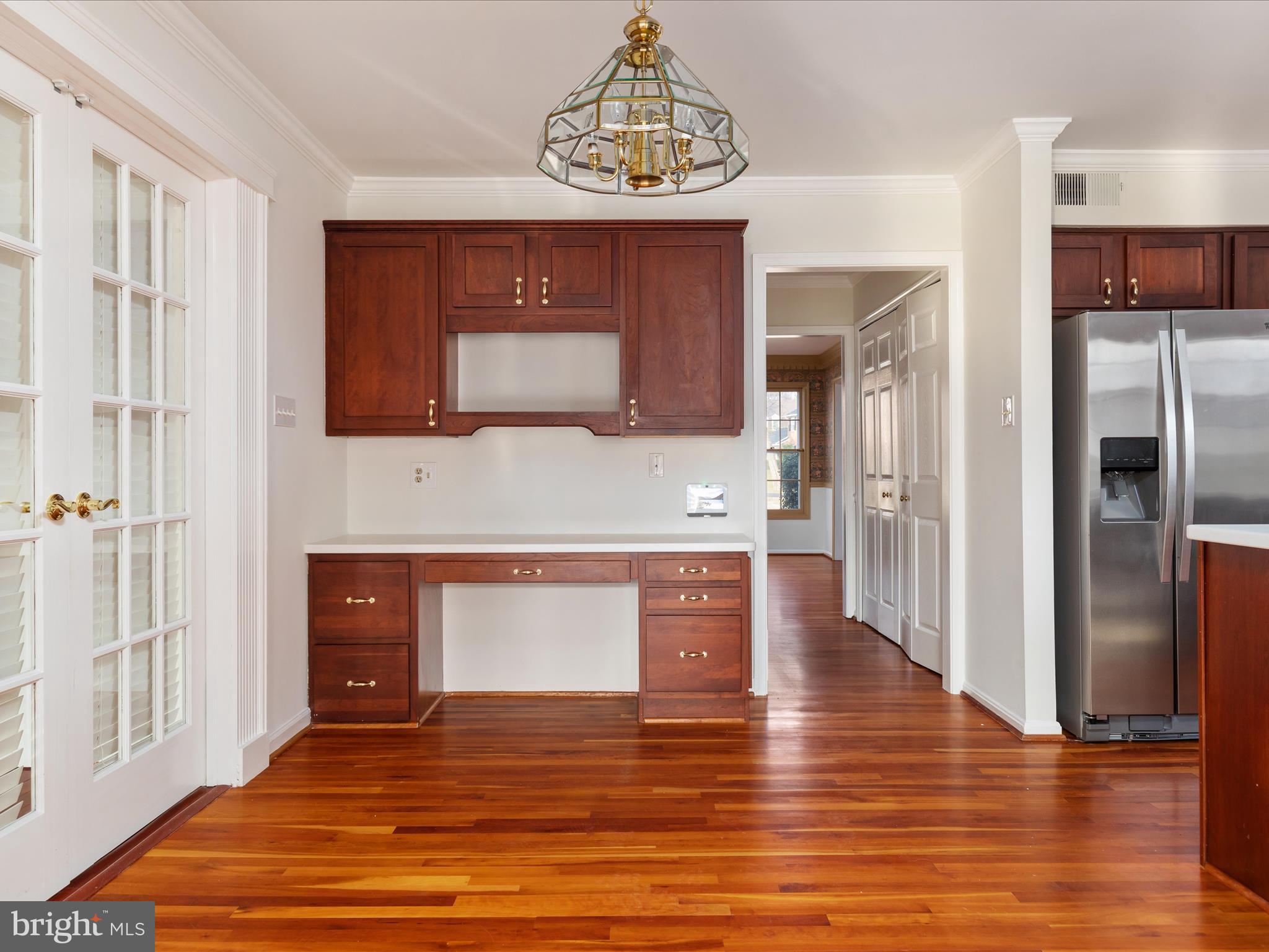11922 Blue Spruce Road Reston, VA 20191 - Photo 7 of 65 a view of kitchen with cabinets and wooden floor