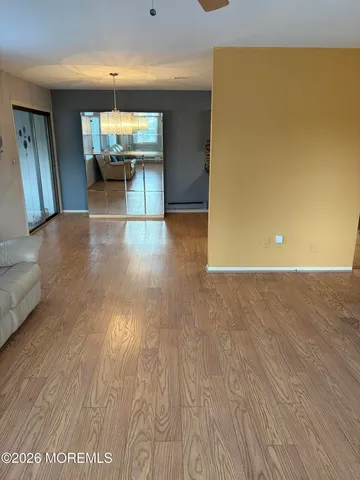 an empty room with wooden floor