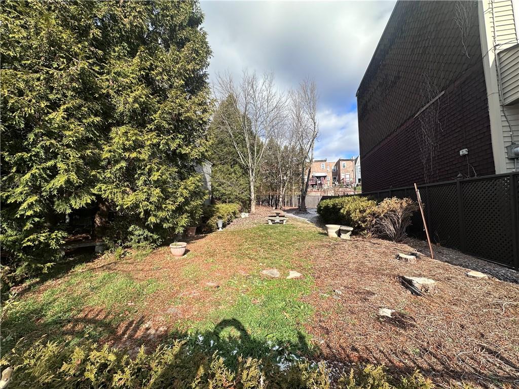 5323 Broad Street Pittsburgh, PA 15224 - Photo 25 of 38 a view of a yard with plants and trees