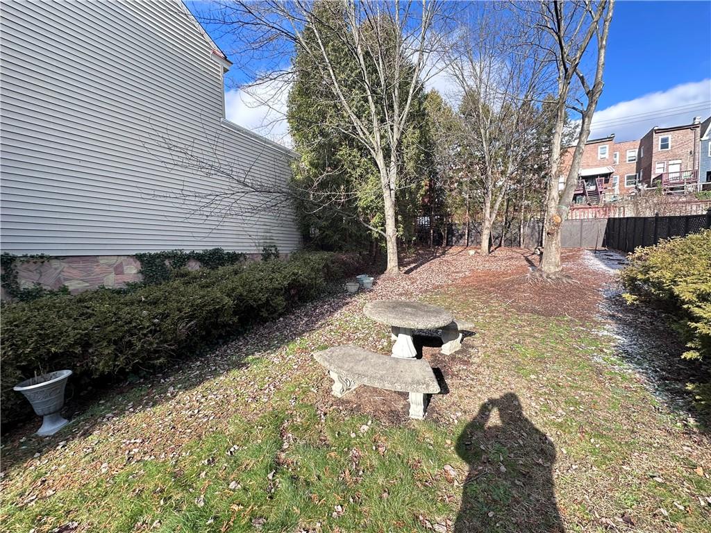 5323 Broad Street Pittsburgh, PA 15224 - Photo 32 of 38 a backyard of a house with a yard and outdoor seating