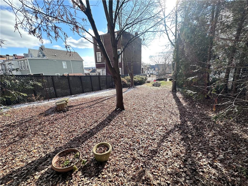 5323 Broad Street Pittsburgh, PA 15224 - Photo 33 of 38 a view of a backyard with large trees