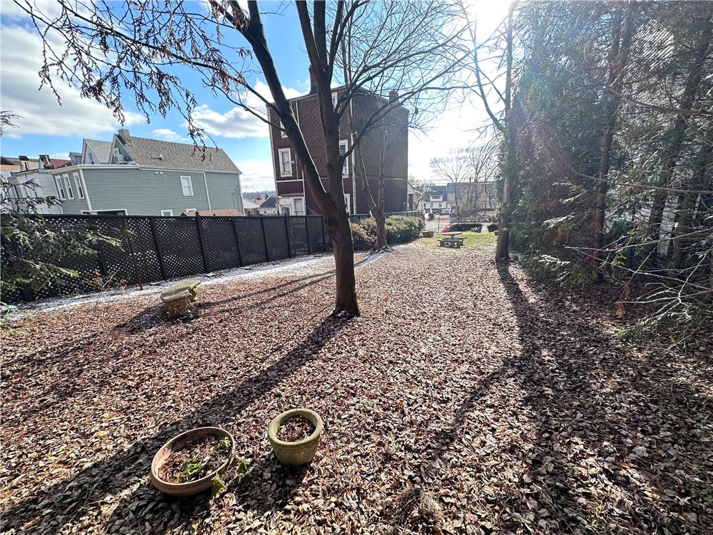 5323 Broad Street Pittsburgh, PA 15224 - Photo 35 of 38 a view of a backyard with large trees
