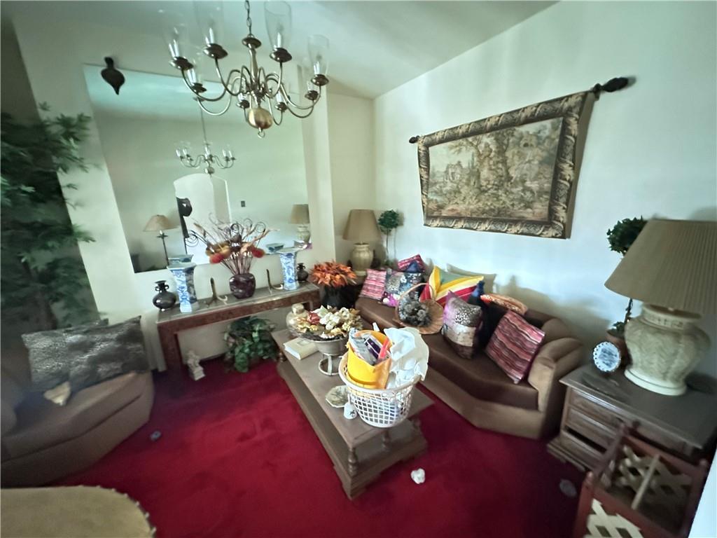 5323 Broad Street Pittsburgh, PA 15224 - Photo 5 of 38 a living room with furniture and a chandelier