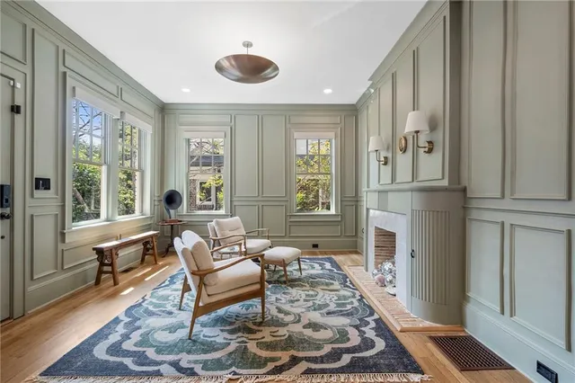 a living room with furniture and a fireplace