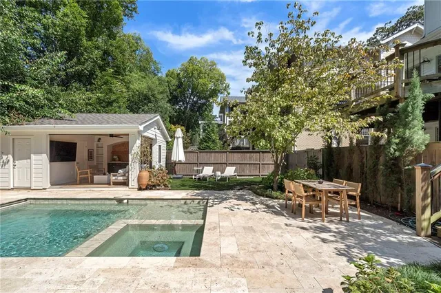 a patio with yard table and chairs