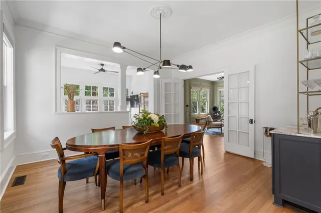 a view of a dining room with furniture and wooden floor