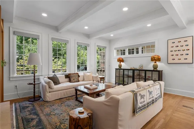 a living room with furniture and windows