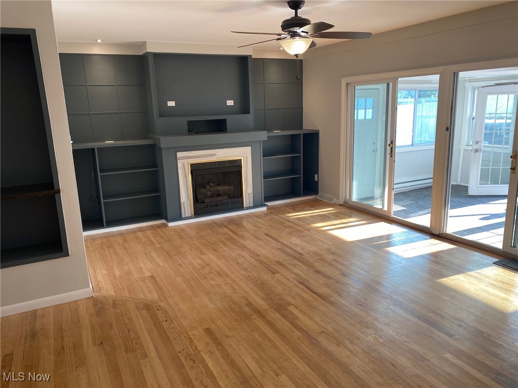 6261 Springwood Road Cleveland, OH 44130 - Photo 9 of 27 Family room with ceiling fan and light wood flooring looking out to the all purpose room