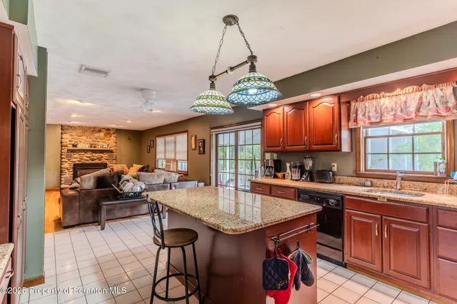 a kitchen with a table and chairs in it