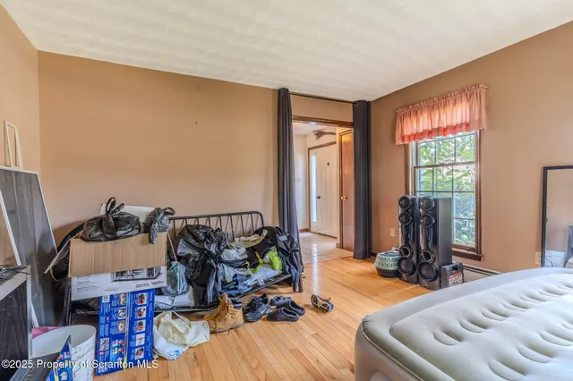 a living room with furniture a window and a chandelier
