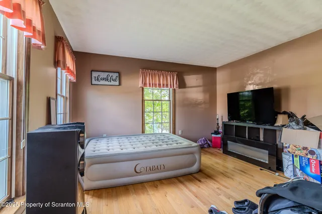 a bed room with furniture and a window