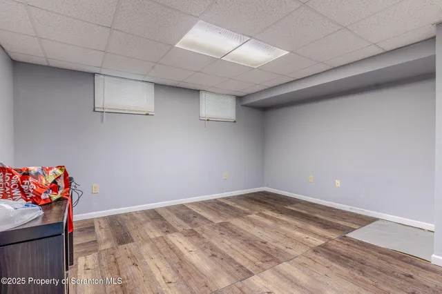 a aerial view of a house with swimming pool and garden