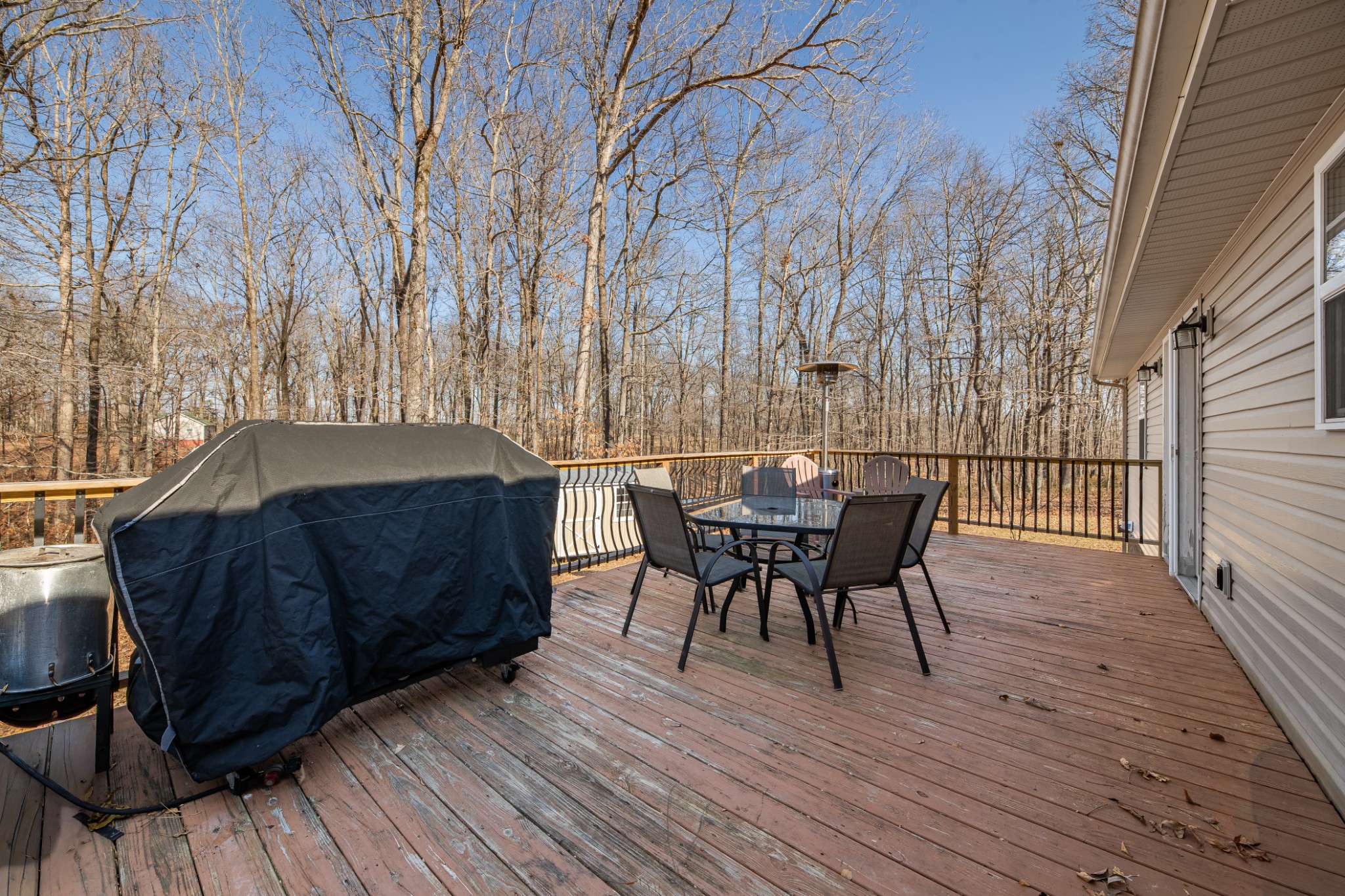 129 Poling Drive Pulaski, TN 38478 - Photo 29 of 67 a view of a roof deck with table and chairs with wooden floor and fence