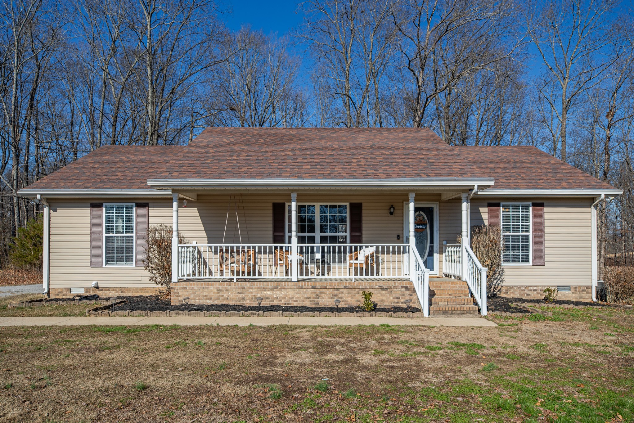 129 Poling Drive Pulaski, TN 38478 - Photo 34 of 67 a front view of a house with garden