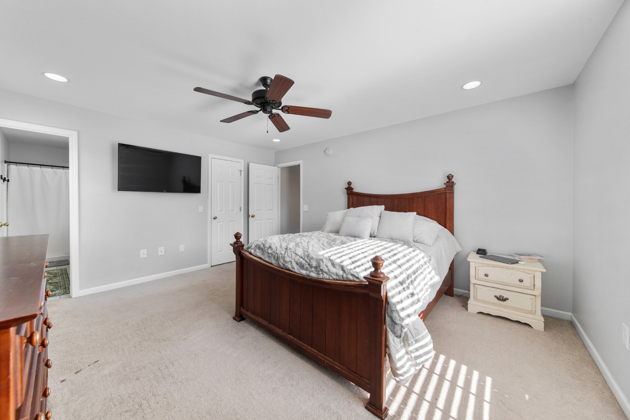 129 Poling Drive Pulaski, TN 38478 - Photo 39 of 67 a spacious bedroom with a bed and a flat screen tv