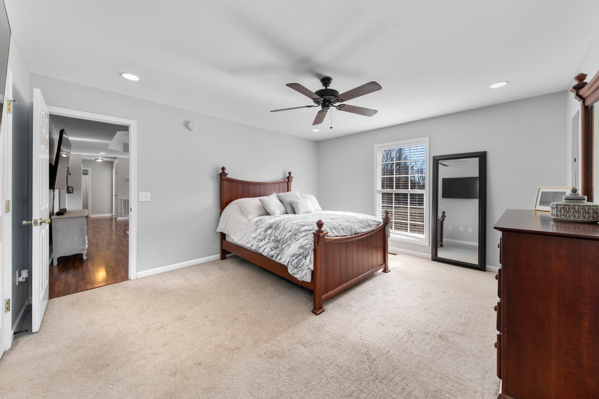 129 Poling Drive Pulaski, TN 38478 - Photo 40 of 67 a spacious bedroom with a bed and a chandelier