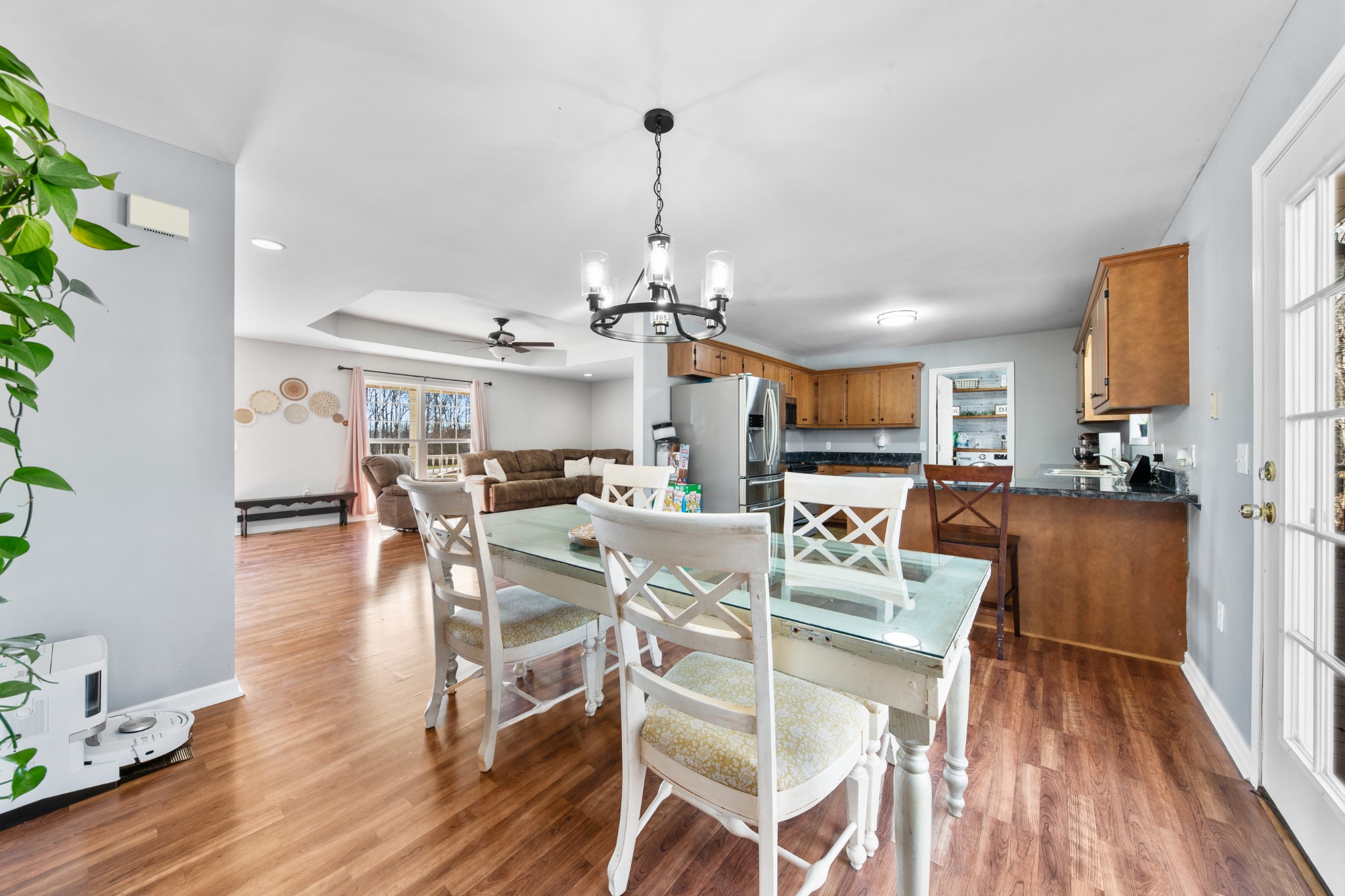 129 Poling Drive Pulaski, TN 38478 - Photo 50 of 67 a view of a dining room and livingroom with furniture wooden floor a chandelier