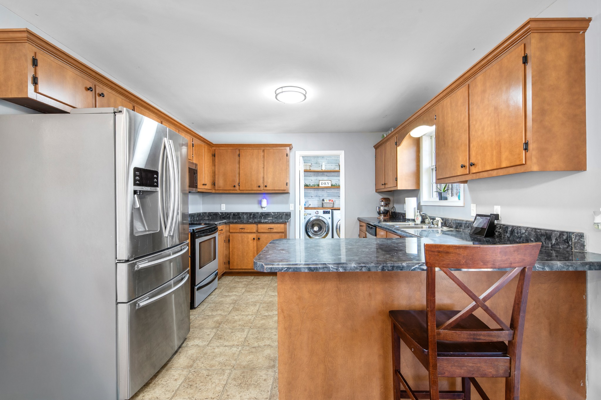 129 Poling Drive Pulaski, TN 38478 - Photo 52 of 67 a kitchen with stainless steel appliances granite countertop a refrigerator a stove and a sink with granite countertops