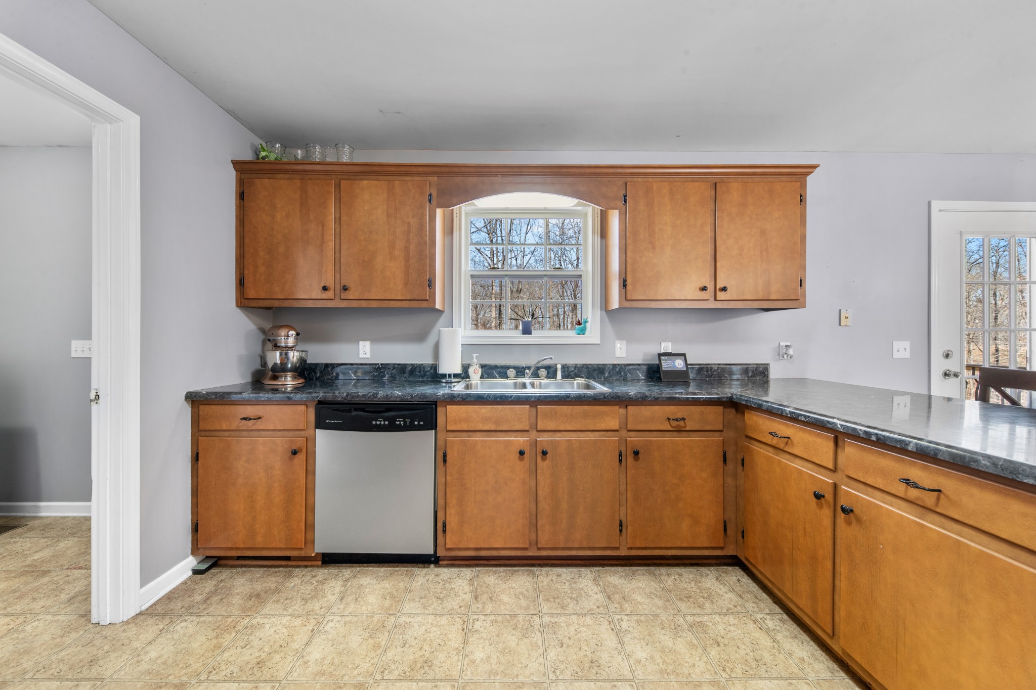129 Poling Drive Pulaski, TN 38478 - Photo 56 of 67 a kitchen with stainless steel appliances granite countertop a stove a sink and a microwave