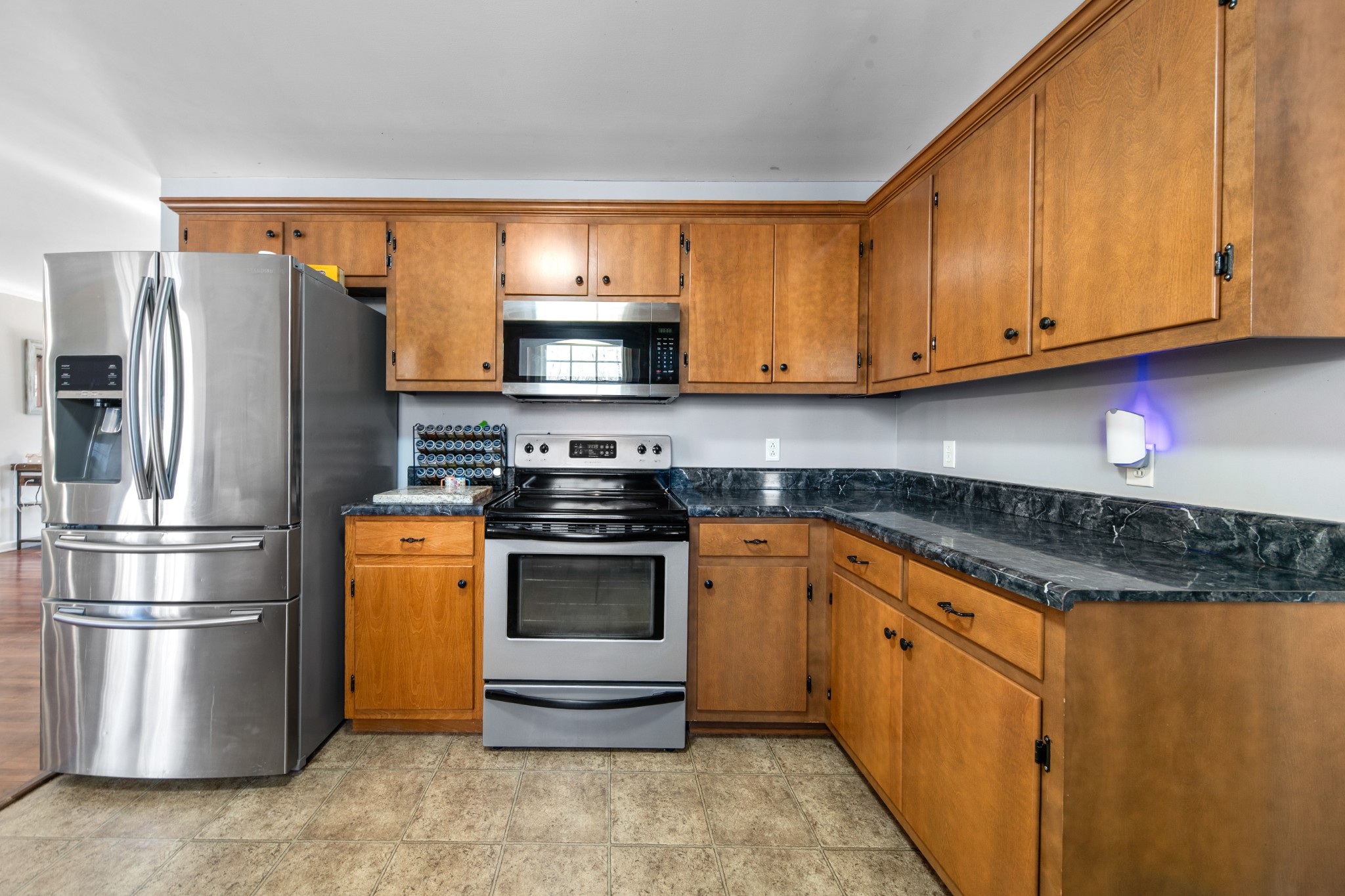 129 Poling Drive Pulaski, TN 38478 - Photo 58 of 67 a kitchen with stainless steel appliances granite countertop a refrigerator stove and sink