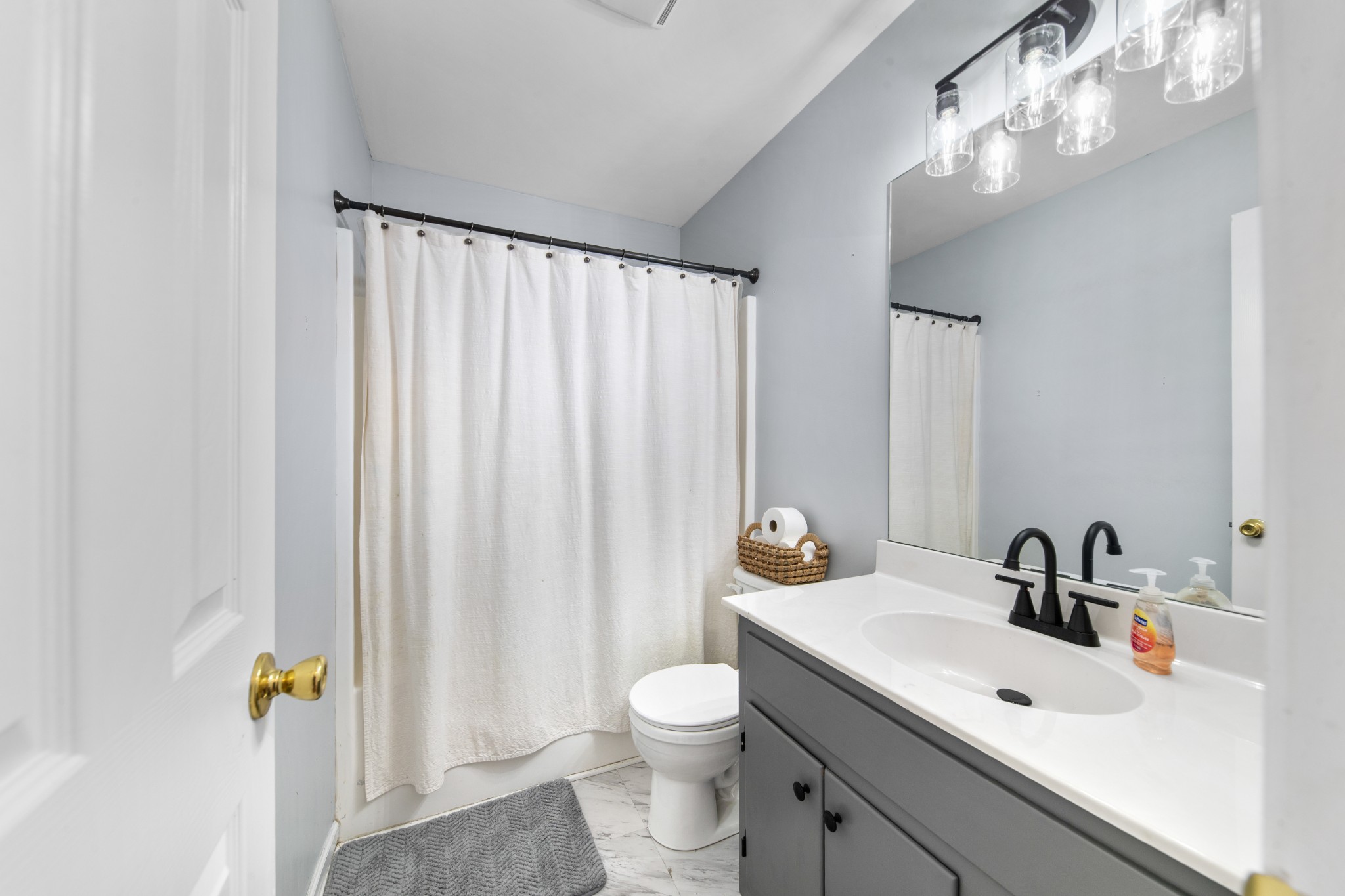 129 Poling Drive Pulaski, TN 38478 - Photo 62 of 67 a bathroom with a toilet a sink and a mirror