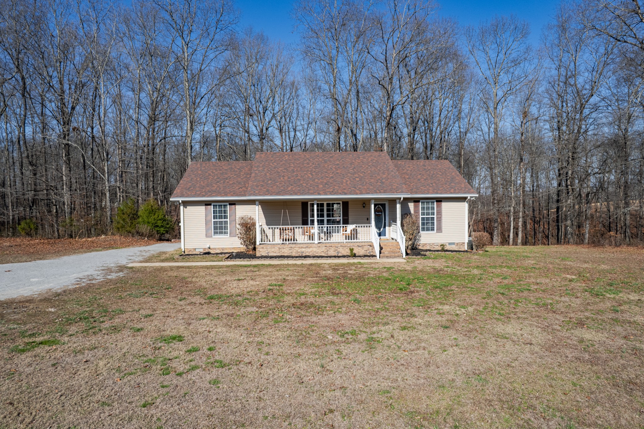 129 Poling Drive Pulaski, TN 38478 - Photo 10 of 67 a front view of a house with a garden