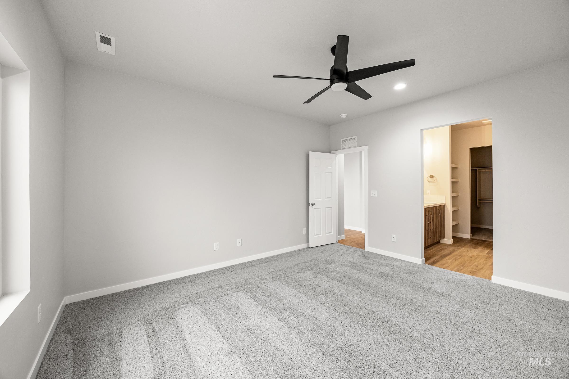 13656 Redway Court Caldwell, ID 83607 - Photo 19 of 21 Walk in closet featuring light carpet
