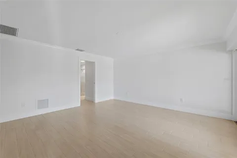 a bathroom with a sink shower and a mirror