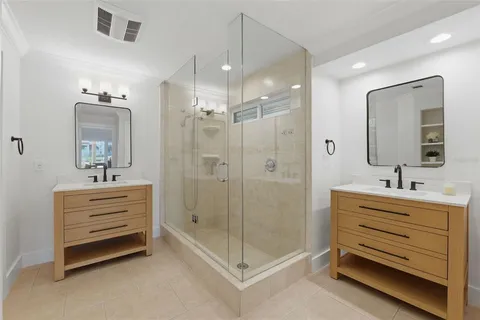a bathroom with a toilet sink and shower