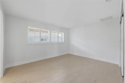 a swimming pool with outdoor seating and yard