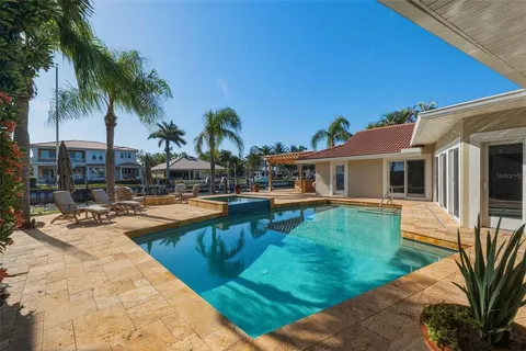 a swimming pool with outdoor seating