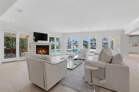 a living room with furniture a dining table and kitchen view