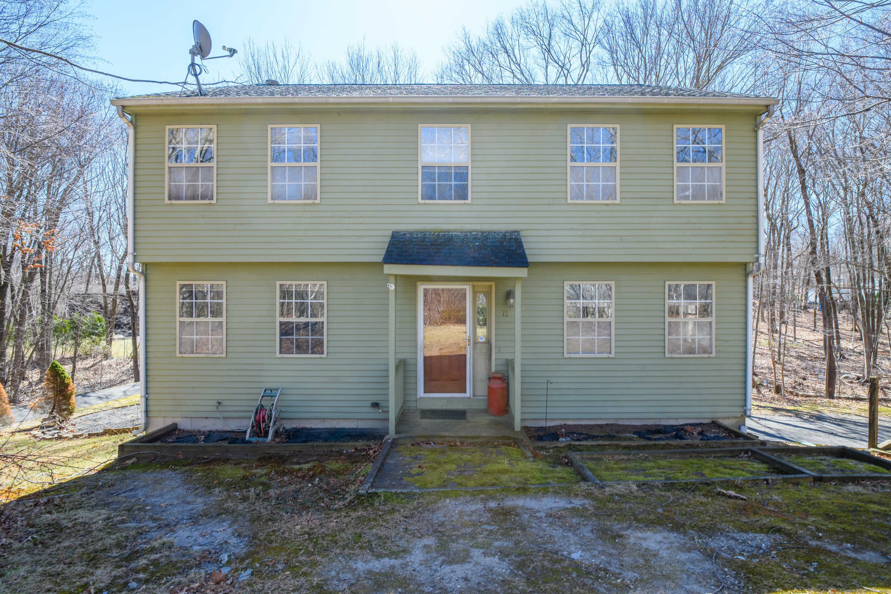 12 Beacon Hill Boulevard Wolcott, CT 06716 - Photo 1 of 1 a front view of a house