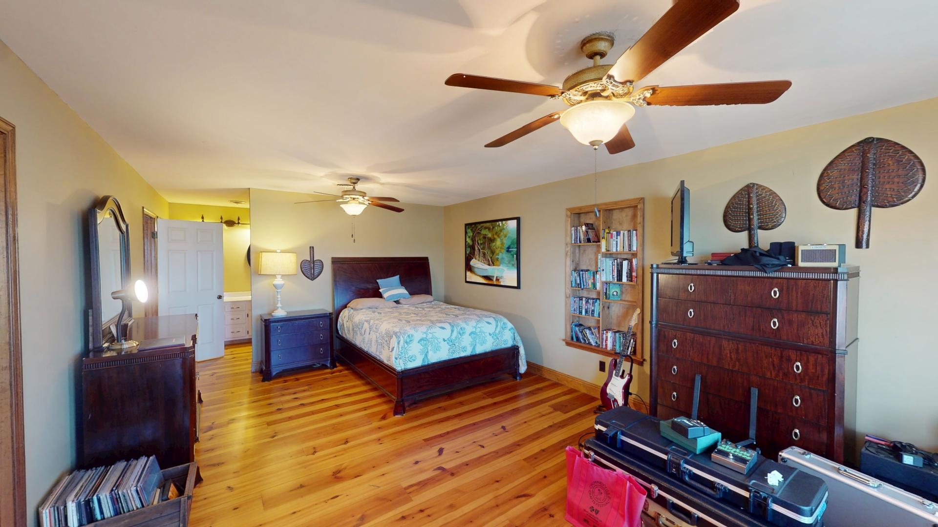 19 Beach Drive Iuka, MS 38852 - Photo 19 of 40 a bedroom with a bed and wooden floor