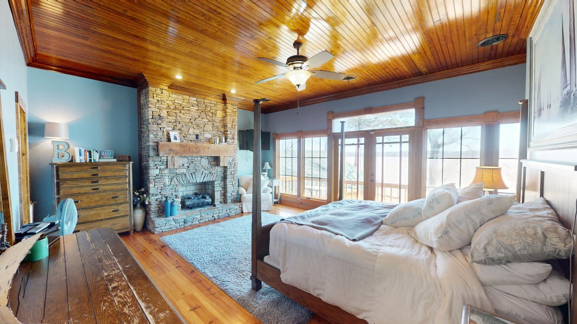 19 Beach Drive Iuka, MS 38852 - Photo 22 of 40 a large bedroom with a bed and large windows