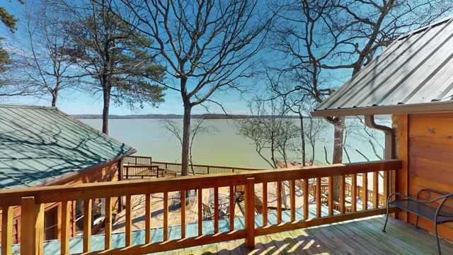 a very nice looking living room with furniture and a large window