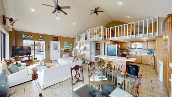 a kitchen with a refrigerator sink and cabinets