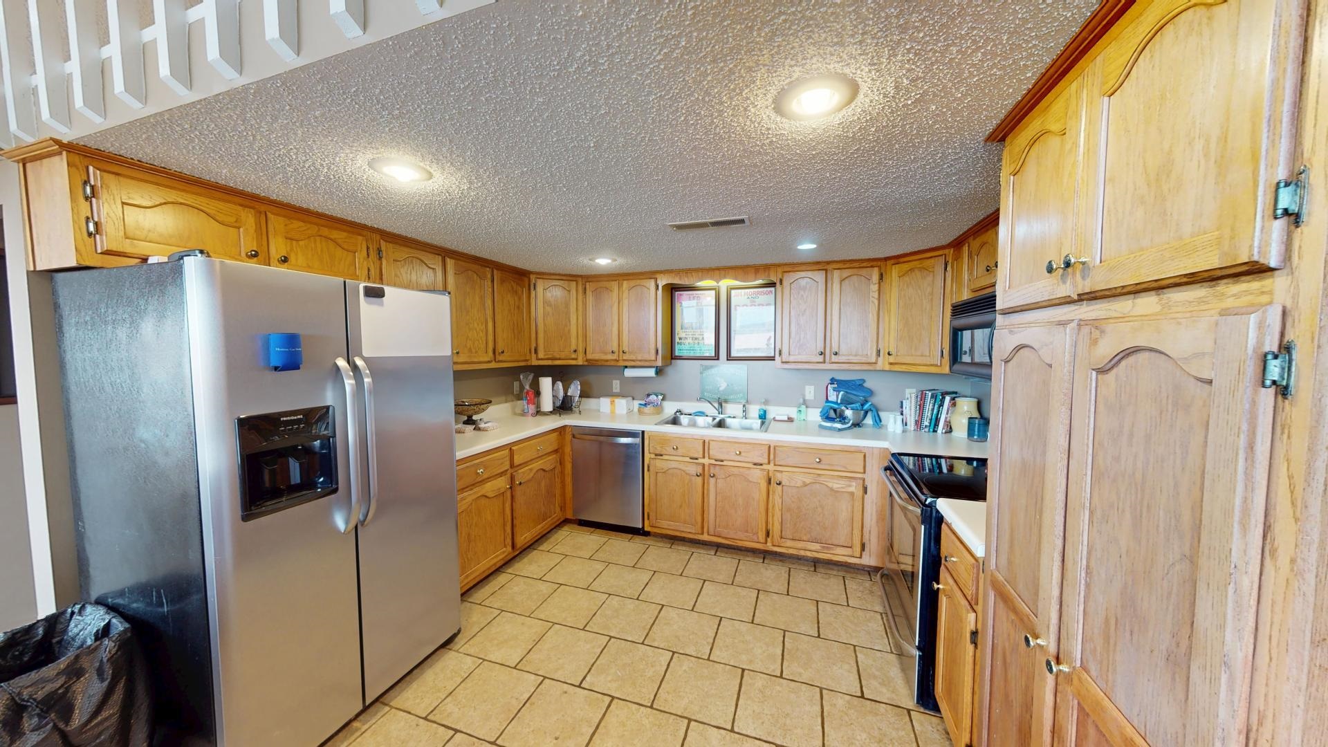 19 Beach Drive Iuka, MS 38852 - Photo 28 of 40 a kitchen with a refrigerator sink and cabinets