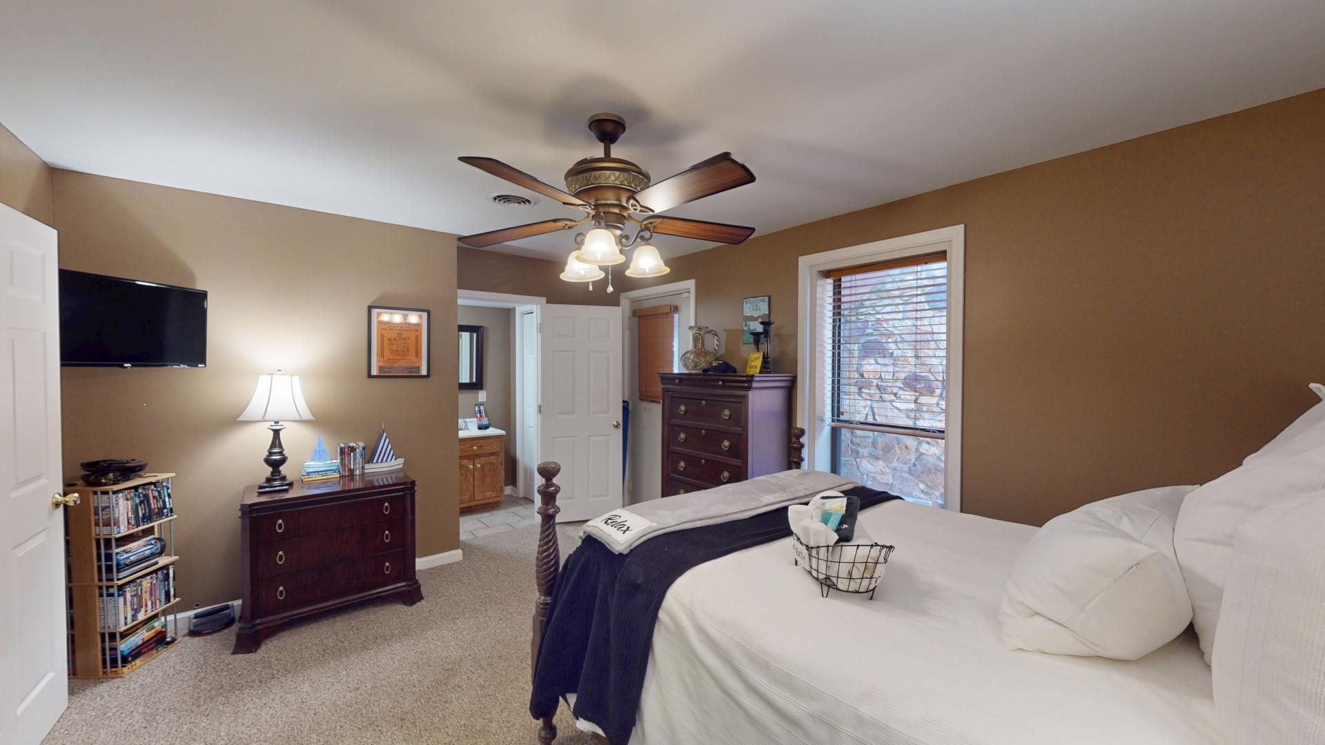 19 Beach Drive Iuka, MS 38852 - Photo 32 of 40 a bedroom with a bed and a chandelier