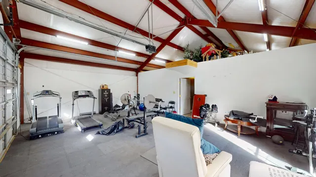 a view of a balcony with two chairs and a table