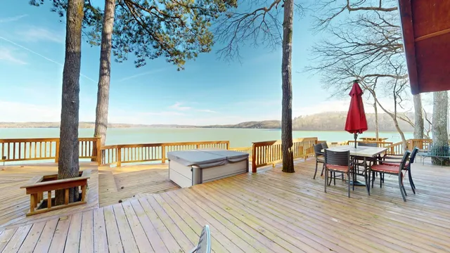 a view of a house with a yard and sitting area