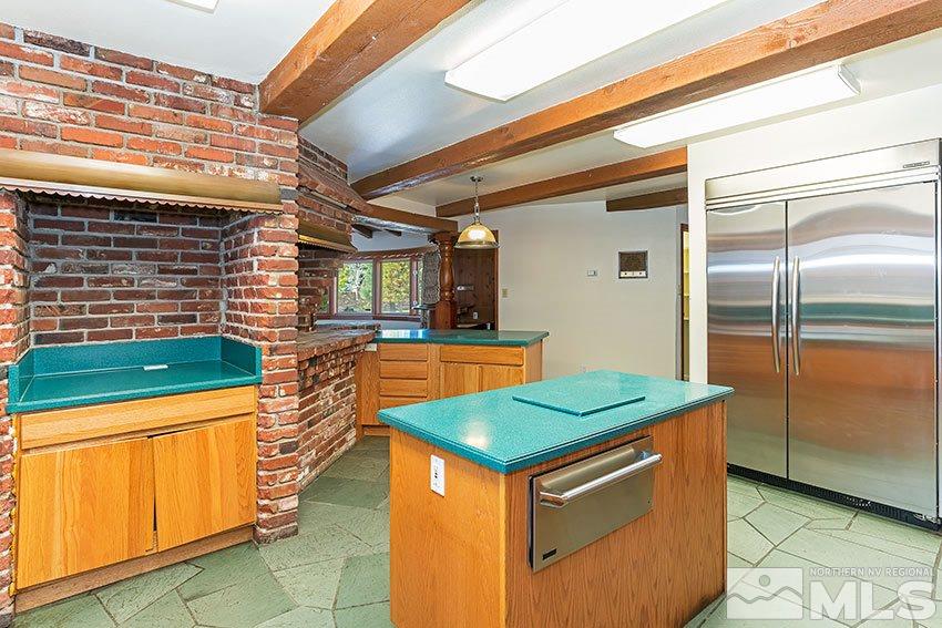 375 Chevy Chase Street Reno, NV 89509 - Photo 12 of 25 a kitchen that has a sink and a stove