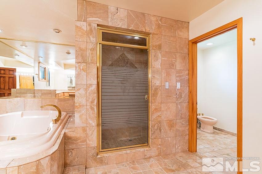 375 Chevy Chase Street Reno, NV 89509 - Photo 16 of 25 a bathroom with a tub shower and sink
