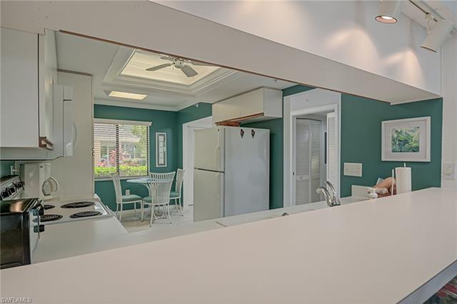 4120 Lorene Drive, Unit 101 Estero, FL 33928 - Photo 13 of 45 a room with a bed a table and chair