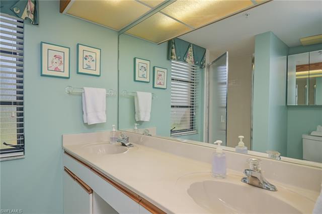 4120 Lorene Drive, Unit 101 Estero, FL 33928 - Photo 17 of 45 a bathroom with a sink and a mirror