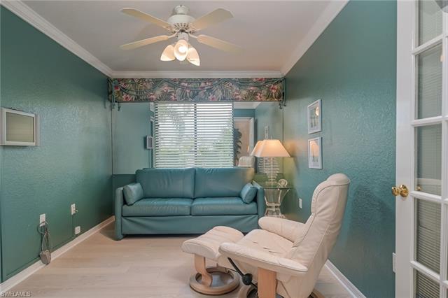 4120 Lorene Drive, Unit 101 Estero, FL 33928 - Photo 18 of 45 a living room with furniture and a chandelier