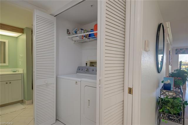 4120 Lorene Drive, Unit 101 Estero, FL 33928 - Photo 23 of 45 a bathroom with a sink and a mirror
