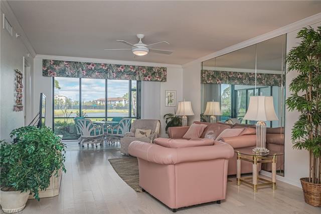 4120 Lorene Drive, Unit 101 Estero, FL 33928 - Photo 3 of 45 a living room with furniture and a large window