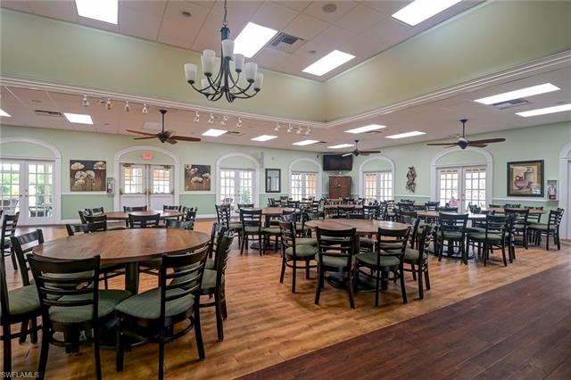 4120 Lorene Drive, Unit 101 Estero, FL 33928 - Photo 39 of 45 a view of a dining area with furniture and wooden floor